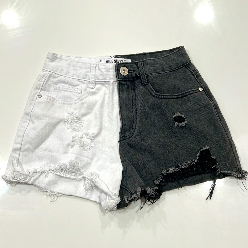 Half white and black jean shorts. From Blue Savvy, size medium.